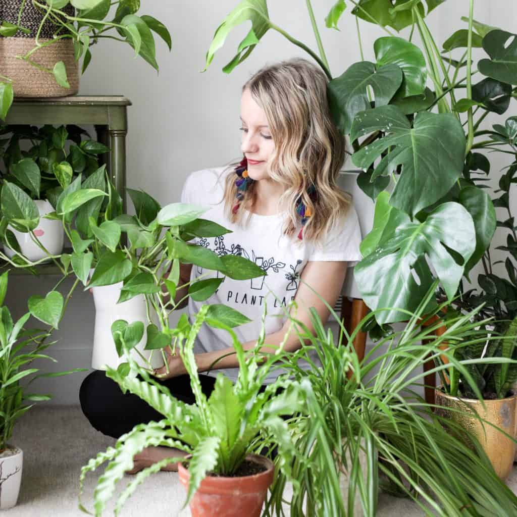 Girl surrounded by plants