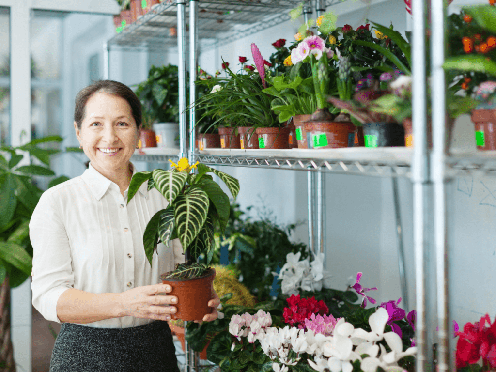 woman holding a zebra plant 